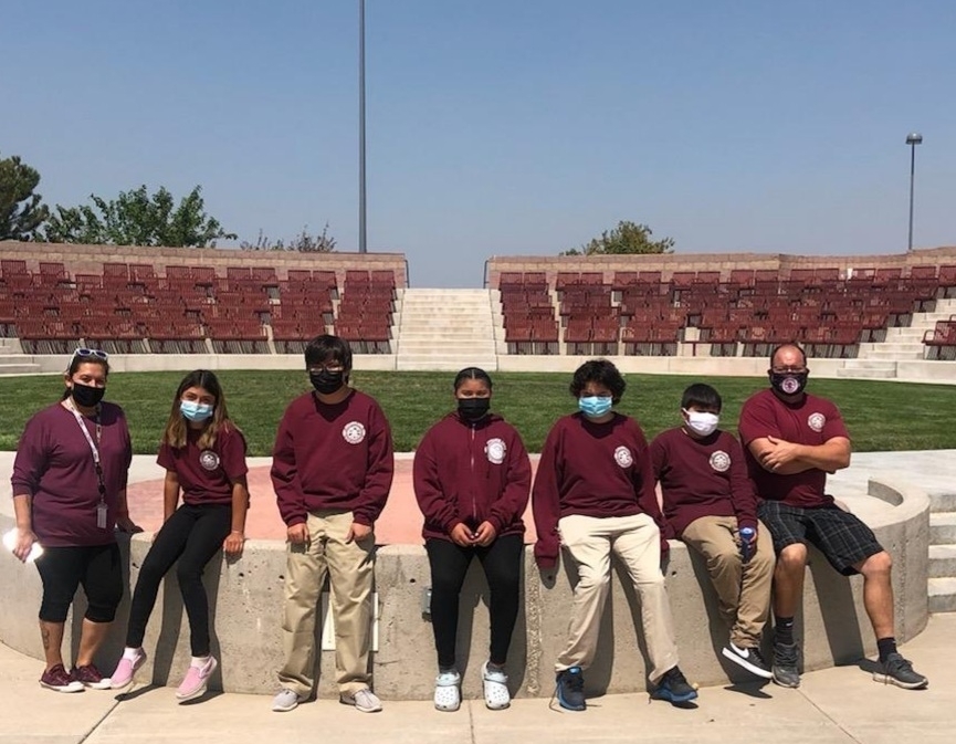 PLHS students sit in the amphitheater courtyard.